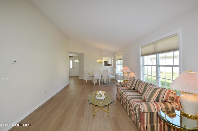3229 Flagstone Ct, Toms River, NJ 08755 - living area featuring lofted ceiling, wood finished floors, and a chandelier