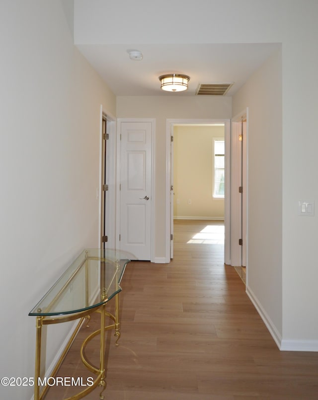 3229 Flagstone Ct, Toms River, NJ 08755 - hall featuring light wood-type flooring and baseboards