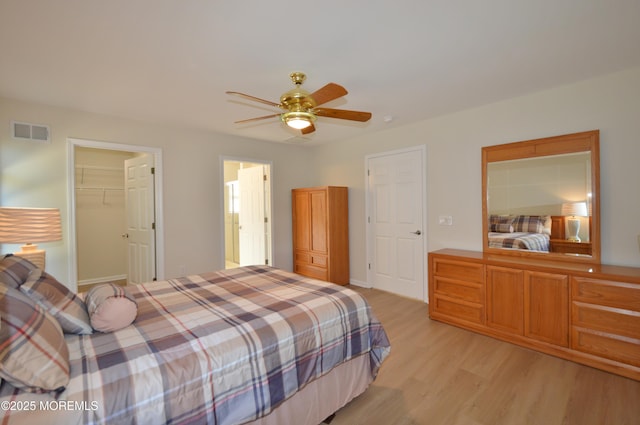 3229 Flagstone Ct, Toms River, NJ 08755 - bedroom with light wood finished floors, ceiling fan, and a spacious closet
