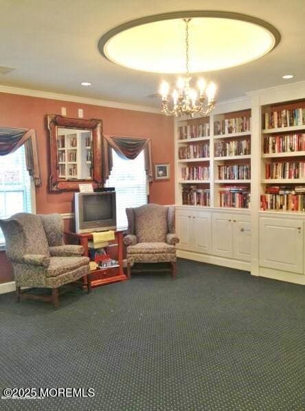 3229 Flagstone Ct, Toms River, NJ 08755 - living area with plenty of natural light, dark carpet, crown molding, a chandelier, and built in features