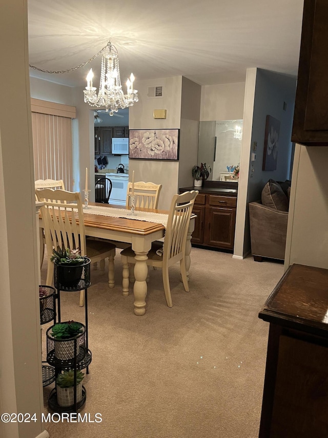 805 Westminster Ct Unit A, Manchester, NJ 08759 - dining space featuring light colored carpet and a chandelier