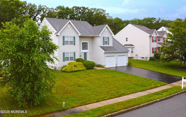 21 Orchid Ln, Barnegat, NJ 08005 - traditional-style house featuring asphalt driveway, a front lawn, and an attached garage