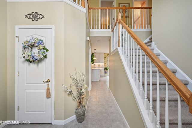 21 Orchid Ln, Barnegat, NJ 08005 - tiled entryway featuring baseboards and stairway