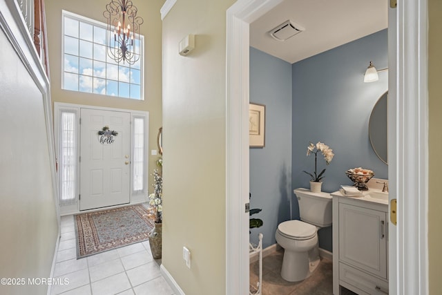21 Orchid Ln, Barnegat, NJ 08005 - entrance foyer featuring light tile patterned floors and a chandelier
