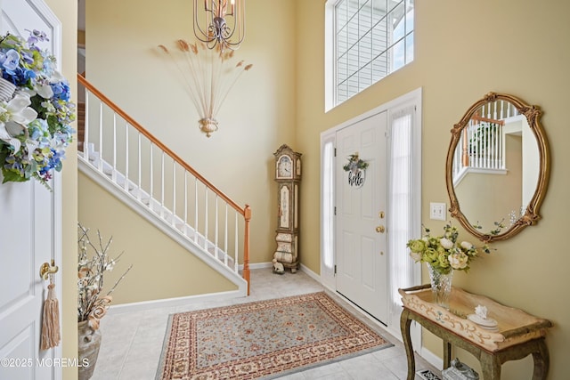 21 Orchid Ln, Barnegat, NJ 08005 - entryway with a chandelier, stairway, a high ceiling, and tile patterned flooring