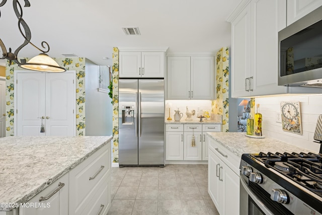 21 Orchid Ln, Barnegat, NJ 08005 - kitchen featuring stainless steel appliances, tasteful backsplash, and white cabinetry