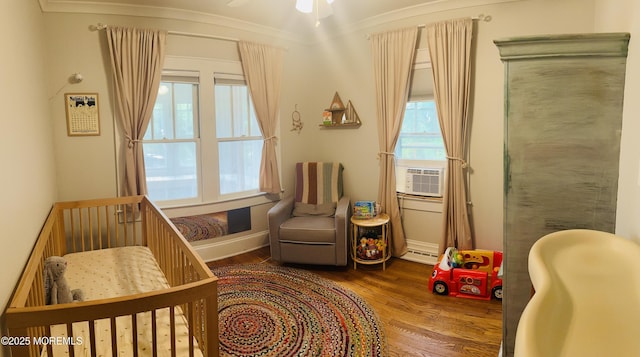 357 Boland Ave, Brick, NJ 08724 - bedroom featuring wood finished floors, a crib, and cooling unit