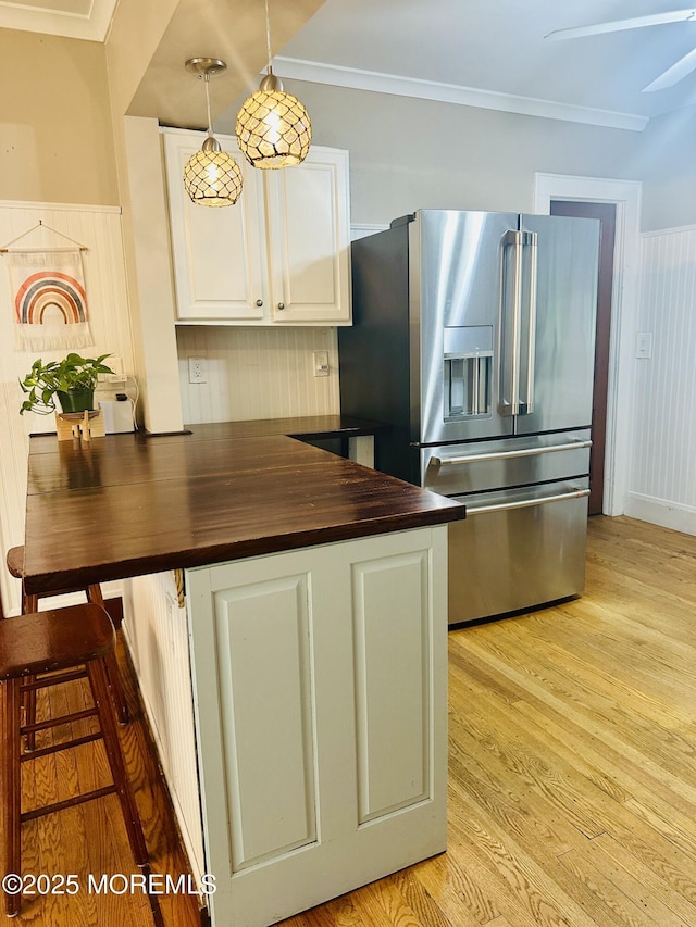 357 Boland Ave, Brick, NJ 08724 - kitchen with high quality fridge, white cabinetry, light wood-type flooring, wood counters, and crown molding