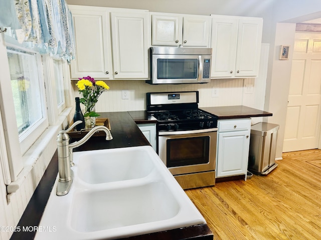 357 Boland Ave, Brick, NJ 08724 - kitchen featuring stainless steel appliances, white cabinets, and light wood-style floors