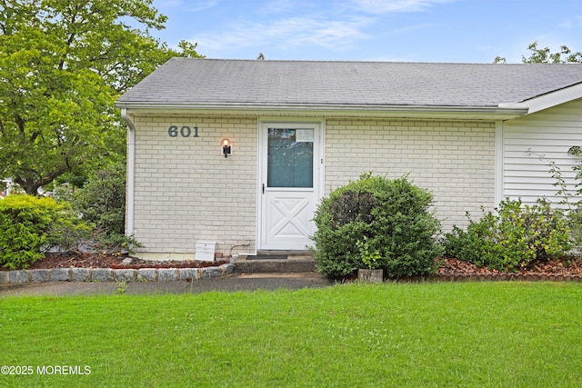 4 Dawn Way, Aberdeen, NJ 07747 - property entrance featuring a yard, brick siding, and roof with shingles