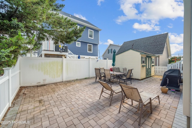 315 Shuster Ave, Ortley Beach, NJ 08751 - fenced backyard with a grill and a patio