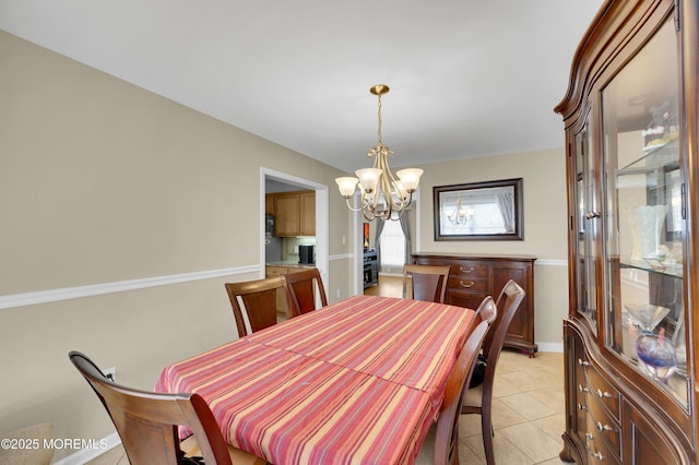 315 Shuster Ave, Ortley Beach, NJ 08751 - dining space featuring a chandelier and light tile patterned floors