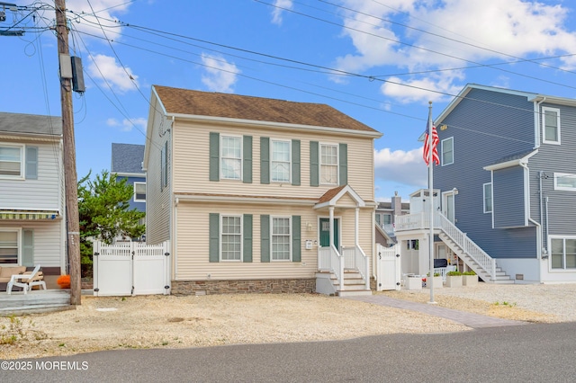 315 Shuster Ave, Ortley Beach, NJ 08751 - colonial house featuring a gate
