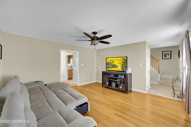 315 Shuster Ave, Ortley Beach, NJ 08751 - living room featuring stairs, a ceiling fan, and light wood-style flooring