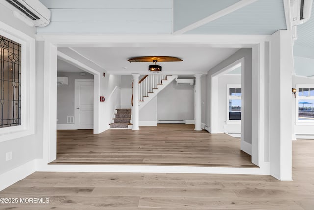 900 Ocean Ave, Bradley Beach, NJ 07720 - foyer entrance with an AC wall unit, stairs, and wood finished floors