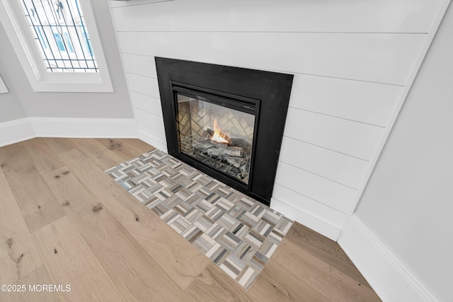 900 Ocean Ave, Bradley Beach, NJ 07720 - detailed view of wood finished floors and a warm lit fireplace
