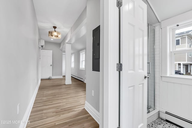 900 Ocean Ave, Bradley Beach, NJ 07720 - hall featuring a baseboard radiator, an AC wall unit, and healthy amount of natural light