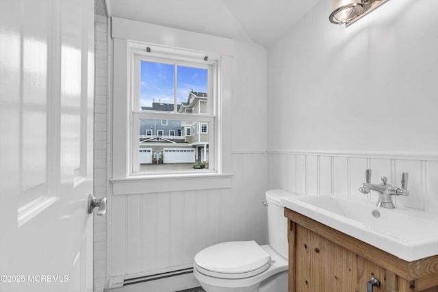 900 Ocean Ave, Bradley Beach, NJ 07720 - bathroom featuring a baseboard heating unit, a wainscoted wall, and vanity