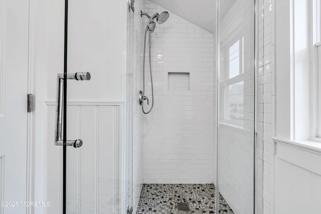 900 Ocean Ave, Bradley Beach, NJ 07720 - bathroom featuring a shower stall, a decorative wall, and wainscoting