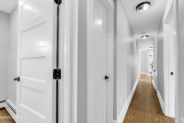 900 Ocean Ave, Bradley Beach, NJ 07720 - hall with wood finished floors and a baseboard heating unit