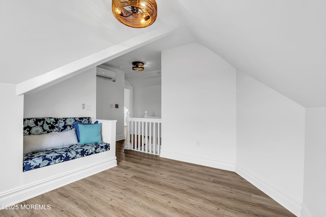 900 Ocean Ave, Bradley Beach, NJ 07720 - additional living space with a wall mounted AC, vaulted ceiling, and wood finished floors