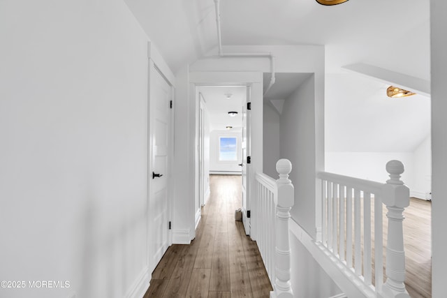 900 Ocean Ave, Bradley Beach, NJ 07720 - corridor featuring an upstairs landing, wood finished floors, vaulted ceiling, and a baseboard heating unit
