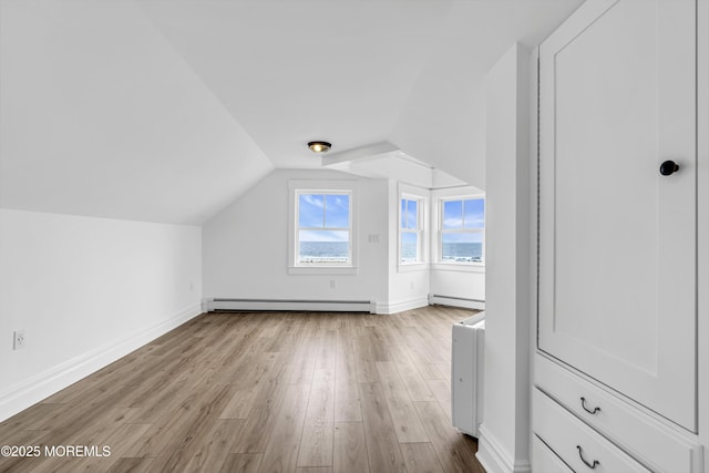 900 Ocean Ave, Bradley Beach, NJ 07720 - additional living space with baseboard heating, a baseboard radiator, lofted ceiling, and wood finished floors