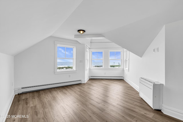 900 Ocean Ave, Bradley Beach, NJ 07720 - bonus room with a baseboard heating unit, vaulted ceiling, and wood finished floors