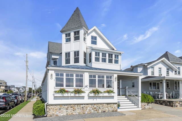 900 Ocean Ave, Bradley Beach, NJ 07720 - view of front of house with a standing seam roof, a porch, roof with shingles, and a metal roof