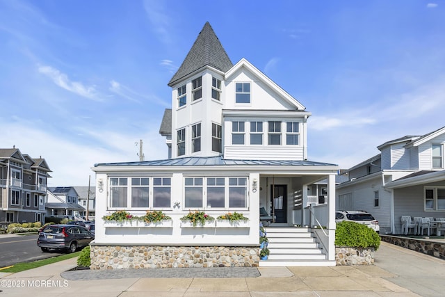 900 Ocean Ave, Bradley Beach, NJ 07720 - view of front of home with a standing seam roof, a metal roof, a shingled roof, and covered porch