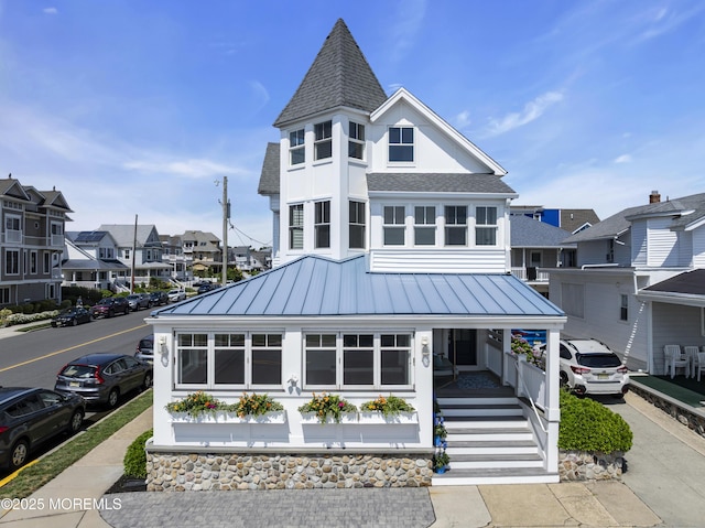 900 Ocean Ave, Bradley Beach, NJ 07720 - victorian home with roof with shingles, a standing seam roof, covered porch, a residential view, and a metal roof
