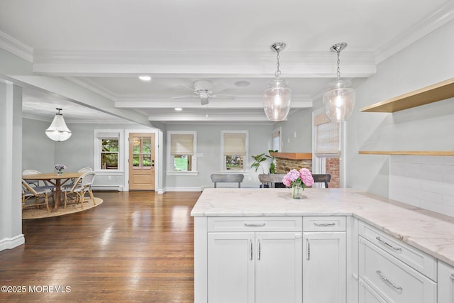 51 Burdge Ave, Brick, NJ 08724 - kitchen with dark wood-style flooring, a peninsula, beam ceiling, white cabinetry, and ornamental molding