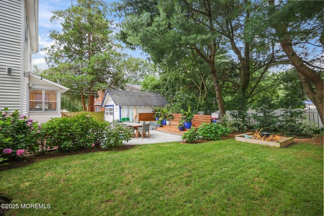 51 Burdge Ave, Brick, NJ 08724 - fenced backyard featuring an outbuilding, a patio, and a garden