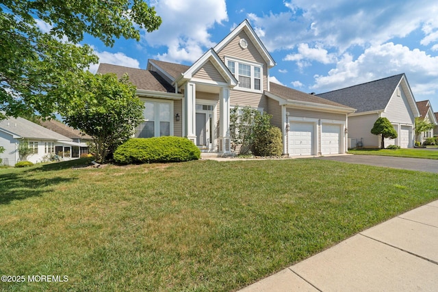 98 Mirage Blvd, Barnegat, NJ 08005 - traditional-style house featuring asphalt driveway, an attached garage, and a front yard