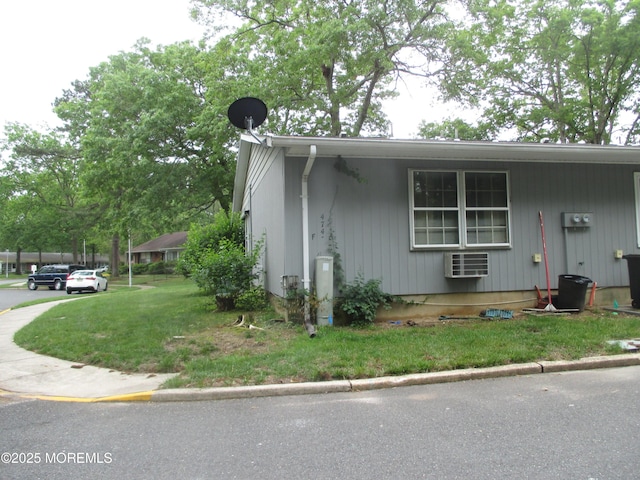 474F Thornbury Ct, Lakewood, NJ 08701 - view of front of house with a front lawn and a wall mounted air conditioner