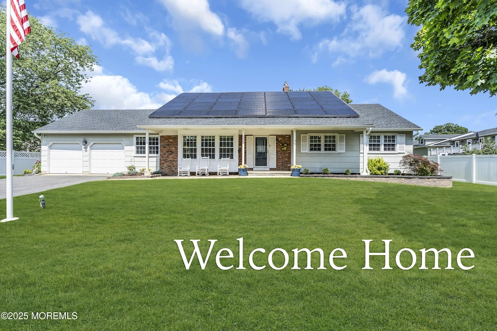 40 S Westfield Rd, Howell, NJ 07731 - ranch-style home with covered porch, solar panels, an attached garage, and driveway