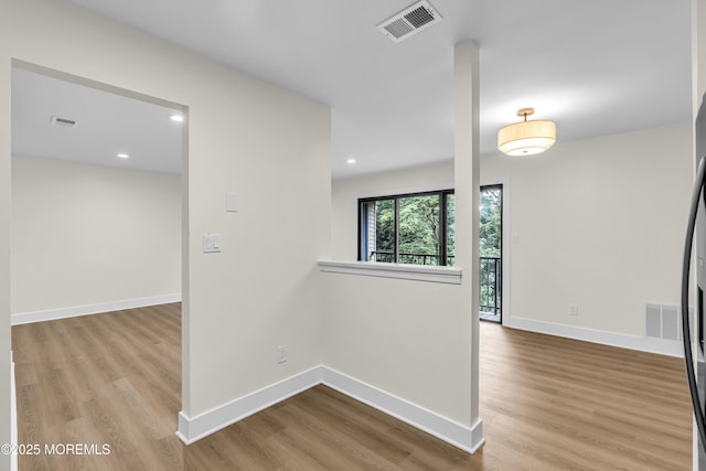 104 Dundee Ct, Aberdeen, NJ 07747 - unfurnished room with wood finished floors and recessed lighting