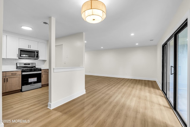 104 Dundee Ct, Aberdeen, NJ 07747 - kitchen with appliances with stainless steel finishes, light wood-type flooring, white cabinets, light countertops, and recessed lighting