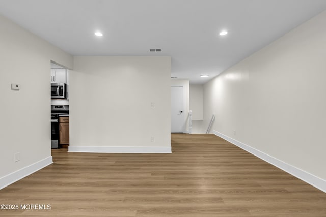 104 Dundee Ct, Aberdeen, NJ 07747 - empty room featuring recessed lighting and light wood-type flooring
