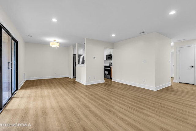 104 Dundee Ct, Aberdeen, NJ 07747 - unfurnished living room with light wood-style floors and recessed lighting