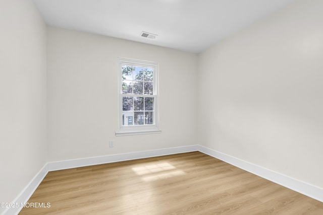 104 Dundee Ct, Aberdeen, NJ 07747 - spare room with light wood-style flooring and baseboards