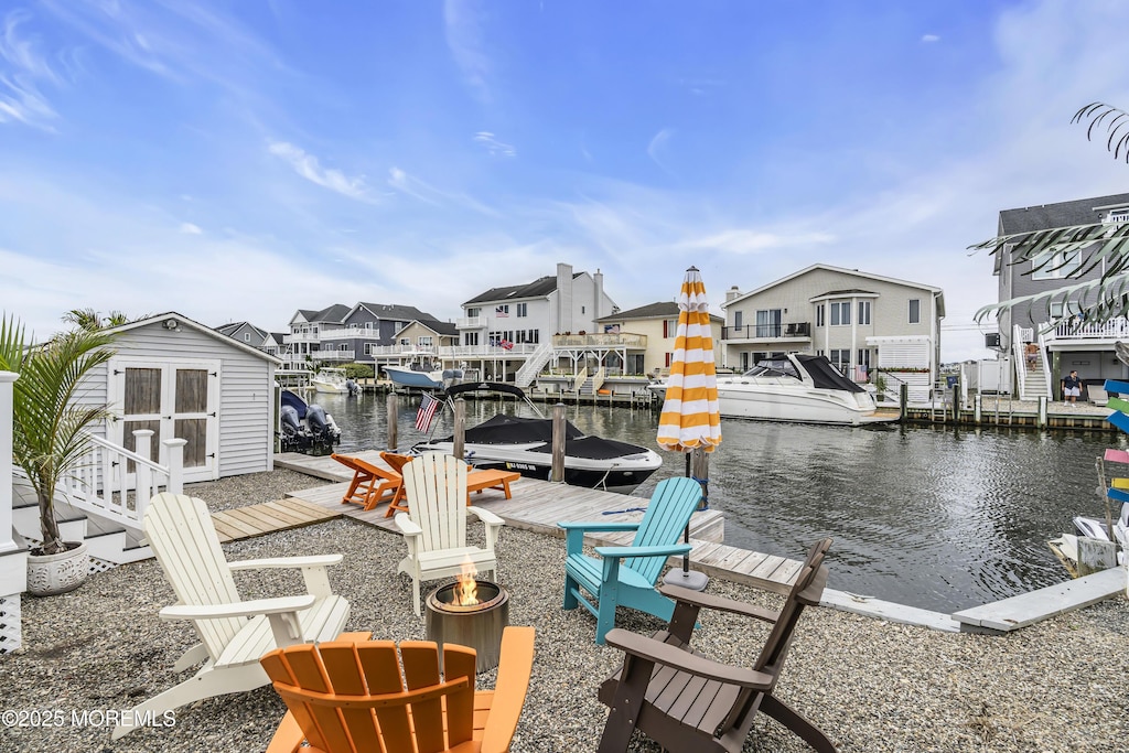 109 Monterey Dr, Brick, NJ 08723 - dock featuring a water view and a residential view