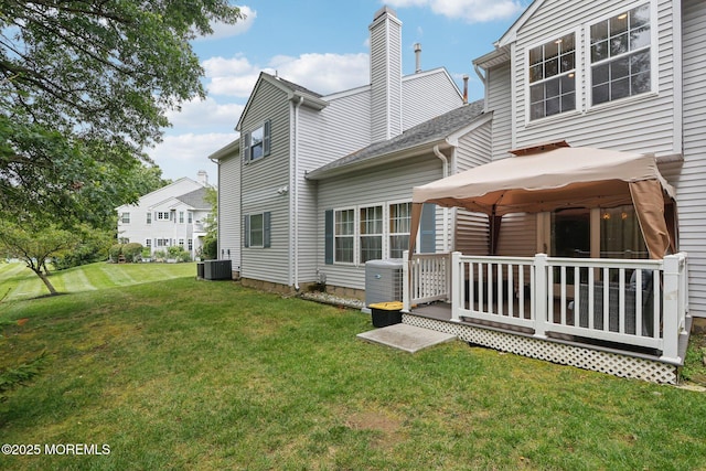149 Jefferson Dr, Ocean Twp, NJ 07712 - rear view of property featuring a gazebo, a yard, a wooden deck, and a chimney