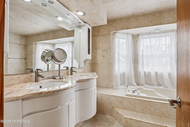 149 Jefferson Dr, Ocean Twp, NJ 07712 - bathroom featuring double vanity and a relaxing tiled tub