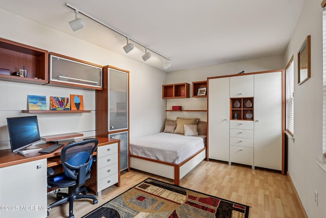 149 Jefferson Dr, Ocean Twp, NJ 07712 - bedroom with track lighting, light wood finished floors, and a desk