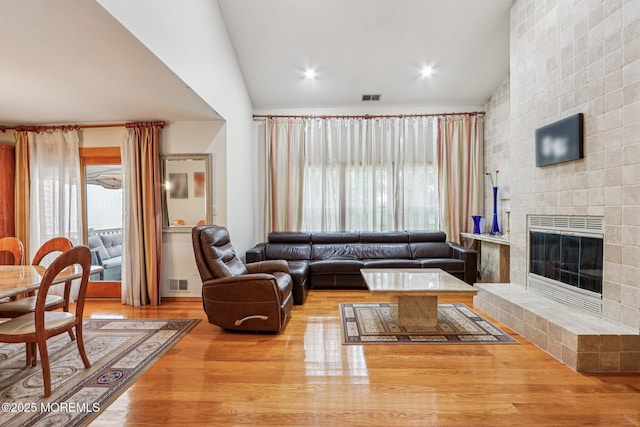 149 Jefferson Dr, Ocean Twp, NJ 07712 - living room with a fireplace, plenty of natural light, lofted ceiling, and wood finished floors