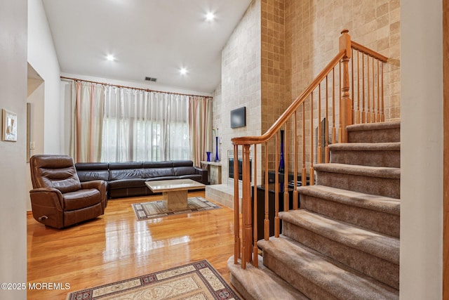 149 Jefferson Dr, Ocean Twp, NJ 07712 - living area featuring stairs, wood finished floors, and recessed lighting
