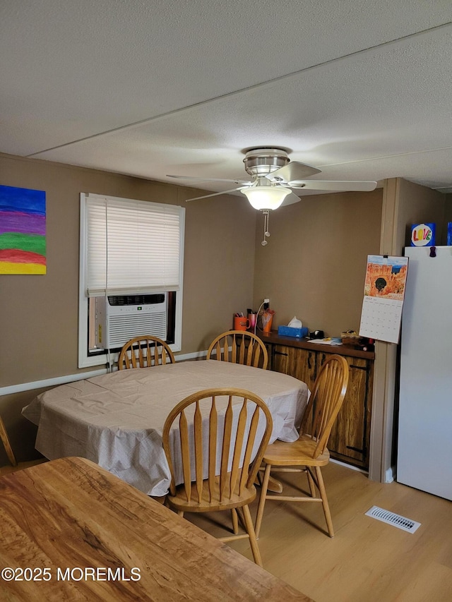 1881 Rte 37 Unit 347, Toms River, NJ 08757 - dining area featuring wood finished floors, a ceiling fan, and cooling unit
