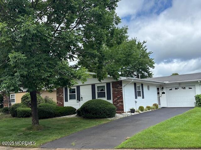 71 Baser Ln, Brick, NJ 08724 - ranch-style home with an attached garage, a front lawn, driveway, and brick siding