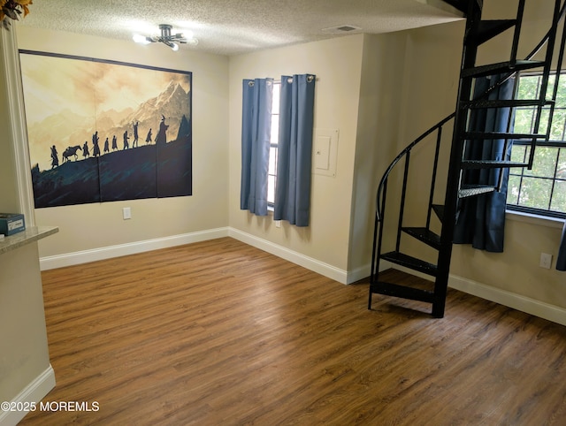 101 Begonia Ct, Jackson, NJ 08527 - empty room featuring wood finished floors, a textured ceiling, and stairway